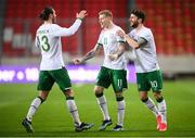 30 March 2021; James McClean of Republic of Ireland celebrates after scoring his side's first goal with team-mates, Jeff Hendrick, left, and Robbie Brady, right, during the international friendly match between Qatar and Republic of Ireland at Nagyerdei Stadion in Debrecen, Hungary. Photo by Stephen McCarthy/Sportsfile