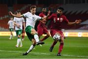 30 March 2021; Jayson Molumby of Republic of Ireland in action against Tarik Salman of Qatar during the international friendly match between Qatar and Republic of Ireland at Nagyerdei Stadion in Debrecen, Hungary. Photo by Stephen McCarthy/Sportsfile