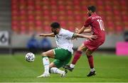 30 March 2021; Cyrus Christie of Republic of Ireland in action against Hassan Alhaydos of Qatar during the international friendly match between Qatar and Republic of Ireland at Nagyerdei Stadion in Debrecen, Hungary. Photo by Stephen McCarthy/Sportsfile