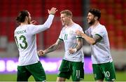 30 March 2021; Republic of Ireland's James McClean celebrates with team-mates Robbie Brady, right, and Jeff Hendrick, left, after scoring his side's goal during the international friendly match between Qatar and Republic of Ireland at Nagyerdei Stadion in Debrecen, Hungary. Photo by Stephen McCarthy/Sportsfile