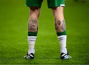 30 March 2021; A detailed view of tattoo's on the legs of James McClean of Republic of Ireland featuring an autism awareness symbol and the text of &quot;The Serenity Prayer&quot; before the international friendly match between Qatar and Republic of Ireland at Nagyerdei Stadion in Debrecen, Hungary. Photo by Stephen McCarthy/Sportsfile
