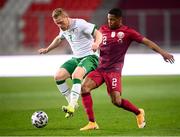 30 March 2021; Daryl Horgan of Republic of Ireland in action against Pedro Miguel of Qatar during the international friendly match between Qatar and Republic of Ireland at Nagyerdei Stadion in Debrecen, Hungary. Photo by Stephen McCarthy/Sportsfile