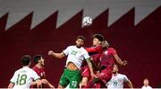 30 March 2021; Cyrus Christie of Republic of Ireland in action against Tarik Salman and Mohammed Muntari, right, of Qatar during the international friendly match between Qatar and Republic of Ireland at Nagyerdei Stadion in Debrecen, Hungary. Photo by Stephen McCarthy/Sportsfile