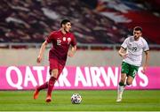 30 March 2021; Karim Boudiaf of Qatar in action against Troy Parrott of Republic of Ireland during the international friendly match between Qatar and Republic of Ireland at Nagyerdei Stadion in Debrecen, Hungary. Photo by Stephen McCarthy/Sportsfile