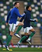 31 March 2021; Jonny Evans, left, and Jamal Lewis of Northern Ireland warm up prior to the FIFA World Cup 2022 qualifying group C match between Northern Ireland and Bulgaria at the National Football Stadium in Windsor Park, Belfast. Photo by David Fitzgerald/Sportsfile