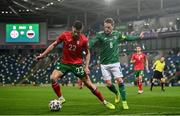 31 March 2021; Andrea Hristov of Bulgaria in action against Steven Davis of Northern Ireland during the FIFA World Cup 2022 qualifying group C match between Northern Ireland and Bulgaria at the National Football Stadium in Windsor Park, Belfast. Photo by David Fitzgerald/Sportsfile