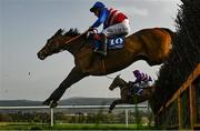 1 April 2021; Pino Boy, with Martin Mooney up, jump the ninth alongside Lessofdnegativity, with Barry Browne up, during the Quirke uPVC Windows (Clonmel) Beginners Steeplechase at Clonmel Racecourse in Tipperary. Photo by Harry Murphy/Sportsfile