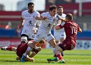 3 April 2021; Antoine Dupont of Toulouse is tackled by Mike Haley, left, and Andrew Conway, both of Munster, during the Heineken Champions Cup Round of 16 match between Munster and Toulouse at Thomond Park in Limerick. Photo by Brendan Moran/Sportsfile