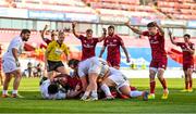 3 April 2021; Munster players, including Conor Murray, right, celebrate after Gavin Coombes, hidden, scores his side's third try during the Heineken Champions Cup Round of 16 match between Munster and Toulouse at Thomond Park in Limerick. Photo by Brendan Moran/Sportsfile