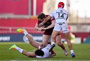 3 April 2021; Chris Farrell of Munster is tackled by Dimitri Delibes, right, and Cheslin Kolbe, both of Toulouse, during the Heineken Champions Cup Round of 16 match between Munster and Toulouse at Thomond Park in Limerick. Photo by Brendan Moran/Sportsfile