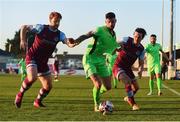 3 April 2021; Adam Foley of Finn Harps in action against Hugh Douglas, left, and James Brown of Drogheda United during the SSE Airtricity League Premier Division match between Drogheda United and Finn Harps at Head in the Game Park in Drogheda, Louth. Photo by Ben McShane/Sportsfile