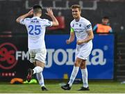 3 April 2021; Jack Keaney of UCD celebrates with teammate Evan Weik after scoring his side's third goal during the SSE Airtricity League First Division match between Cobh Ramblers and UCD at St Colman's Park in Cobh, Cork. Photo by Eóin Noonan/Sportsfile