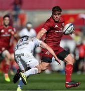 3 April 2021; CJ Stander of Munster is tackled by Zack Holmes of Toulouse during the Heineken Champions Cup Round of 16 match between Munster and Toulouse at Thomond Park in Limerick. Photo by Ramsey Cardy/Sportsfile