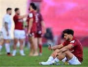 3 April 2021; Romain Ntamack of Toulouse sits on the pitch wearing a Munster jersey following his side's victory in the Heineken Champions Cup Round of 16 match between Munster and Toulouse at Thomond Park in Limerick. Photo by Ramsey Cardy/Sportsfile