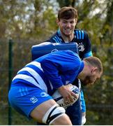 5 April 2021; Ross Molony, below, and Ryan Baird during Leinster Rugby squad training at UCD in Dublin. Photo by Ramsey Cardy/Sportsfile