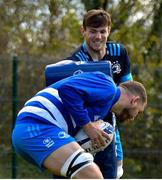 5 April 2021; Ross Molony, below, and Ryan Baird during Leinster Rugby squad training at UCD in Dublin. Photo by Ramsey Cardy/Sportsfile