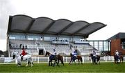 5 April 2021; Members of the local hunt parade with runners and riders to an empty stand prior to the BoyleSports Irish Grand National Steeplechase during day three of the Fairyhouse Easter Festival at the Fairyhouse Racecourse in Ratoath, Meath. Photo by Harry Murphy/Sportsfile