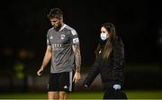 2 April 2021; George Heaven of Cork City with physio Orla McSweeney during the SSE Airtricity League First Division match between Cabinteely and Cork City at Stradbrook Park in Blackrock, Dublin. Photo by David Fitzgerald/Sportsfile