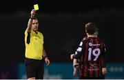9 April 2021; Tyreke Wilson, 19, of Bohemians receives a yellow card from referee Rob Harvey during the SSE Airtricity League Premier Division match between Dundalk and Bohemians at Oriel Park in Dundalk, Louth. Photo by Ben McShane/Sportsfile