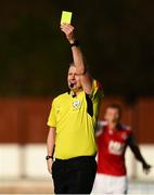 9 April 2021; Referee Ben Connolly shows a yellow card during the SSE Airtricity League Premier Division match between St Patrick's Athletic and Derry City at Richmond Park in Dublin. Photo by Harry Murphy/Sportsfile
