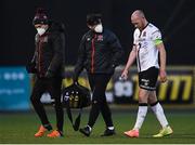 9 April 2021; Chris Shields of Dundalk leaves the pitch with an injury alongside Dundalk physiotherapist David Murphy, centre, and Dr Dualtach Mac Colgáin, Dundalk team doctor, left, during the SSE Airtricity League Premier Division match between Dundalk and Bohemians at Oriel Park in Dundalk, Louth. Photo by Ben McShane/Sportsfile