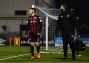 9 April 2021; Andy Lyons of Bohemians makes his way to the dugout after picking up an injury, alongside Bohemians physiotherapist Dr Paul Kirwan, right, during the SSE Airtricity League Premier Division match between Dundalk and Bohemians at Oriel Park in Dundalk, Louth. Photo by Ben McShane/Sportsfile