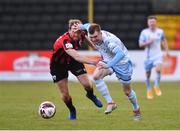 10 April 2021; Mark Doyle of Drogheda United in action against Aaron O'Driscoll of Longford Town during the SSE Airtricity League Premier Division match between Longford Town and Drogheda United at Bishopsgate in Longford. Photo by Sam Barnes/Sportsfile