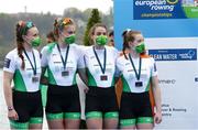 11 April 2021; Ireland rowers, from left, Aifric Keogh, Eimear Lambe, Fiona Murtagh and Emily Hegarty with their silver medals after the Women's Four A Final during Day 3 of the European Rowing Championships 2021 at Varese in Italy. Photo by Roberto Bregani/Sportsfile