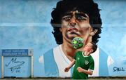 12 April 2021; Local resident Johnny Figo Murphy, age 9, from Dublin shows his skills in front of a mural by Dublin artist Chelsea Jacobs depicting the late Argentine footballer Diego Maradona at Havelock Square in Dublin. Photo by David Fitzgerald/Sportsfile