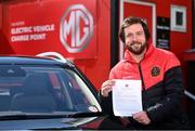 13 April 2021; Bohemians have taken two significant actions in the fight against climate change. Firstly, by signing up, through our Climate Justice Officer, to the UN’s Sports for Climate Action Framework and, secondly, by announcing MG Motor Ireland as the club's Official Vehicle Partner for 2021. The partnership will see club players and manager Keith Long drive 100% electric vehicles. Pictured at Dalymount Park in Dublin is Sean McCabe, Bohemians Climate Officer, with a signed copy of Sports for Climate Action Framework. Photo by Sam Barnes/Sportsfile