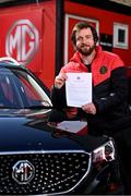 13 April 2021; Bohemians have taken two significant actions in the fight against climate change. Firstly, by signing up, through our Climate Justice Officer, to the UN’s Sports for Climate Action Framework and, secondly, by announcing MG Motor Ireland as the club's Official Vehicle Partner for 2021. The partnership will see club players and manager Keith Long drive 100% electric vehicles. Pictured at Dalymount Park in Dublin is Sean McCabe, Bohemians Climate Officer, with a signed copy of Sports for Climate Action Framework. Photo by Sam Barnes/Sportsfile
