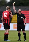 10 April 2021; Referee Graham Kelly shows Aaron O'Driscoll of Longford Town a yellow card during the SSE Airtricity League Premier Division match between Longford Town and Drogheda United at Bishopsgate in Longford. Photo by Sam Barnes/Sportsfile