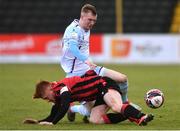 10 April 2021; Mark Doyle of Drogheda United is tackled by Aodh Dervin of Longford Town during the SSE Airtricity League Premier Division match between Longford Town and Drogheda United at Bishopsgate in Longford. Photo by Sam Barnes/Sportsfile