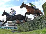 10 April 2020; Minella Times, with Rachael Blackmore up, take the water jump trailing Burrows Saint, with Paddy Mullins up, on their way to winning the Randox Grand National at the Aintree Racecourse in Liverpool, England. Photo by Hugh Routledge/Sportsfile