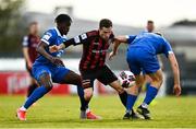 16 April 2021; Liam Burt of Bohemians is tackled by Tunmise Sobowale, left, and Cameron Evans of Waterford during the SSE Airtricity League Premier Division match between Waterford and Bohemians at the RSC in Waterford. Photo by Eóin Noonan/Sportsfile