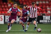 16 April 2021; Will Patching of Derry City in action against Dane Massey, left, and Gary Deegan of Drogheda United during the SSE Airtricity League Premier Division match between Derry City and Drogheda United at the Ryan McBride Brandywell Stadium in Derry. Photo by Stephen McCarthy/Sportsfile
