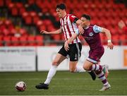 16 April 2021; Eoin Toal of Derry City in action against Chris Lyons of Drogheda United during the SSE Airtricity League Premier Division match between Derry City and Drogheda United at the Ryan McBride Brandywell Stadium in Derry. Photo by Stephen McCarthy/Sportsfile