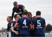 17 April 2021; Sam Bone of St Patrick's Athletic, 4, celebrates with team-mates including Ian Bermingham, top, after scoring his side's first goal during the SSE Airtricity League Premier Division match between Dundalk and St Patrick's Athletic at Oriel Park in Dundalk, Louth. Photo by Stephen McCarthy/Sportsfile