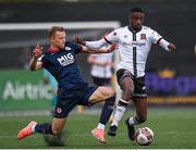 17 April 2021; Junior Ogedi-Uzokwe of Dundalk is tackled by Jamie Lennon of St Patrick's Athletic during the SSE Airtricity League Premier Division match between Dundalk and St Patrick's Athletic at Oriel Park in Dundalk, Louth. Photo by Ben McShane/Sportsfile