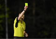 16 April 2021; Referee Oliver Moran shows the yellow card to Colm Whelan of UCD, not pictured, during the SSE Airtricity League First Division match between UCD and Cabinteely at the UCD Bowl in Belfield, Dublin. Photo by Piaras Ó Mídheach/Sportsfile
