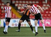20 April 2021; Cameron McJannet of Derry City in action against Patrick Hoban of Dundalk during the SSE Airtricity League Premier Division match between Derry City and Dundalk at the Ryan McBride Brandywell Stadium in Derry. Photo by Stephen McCarthy/Sportsfile