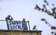20 April 2021; Supporters watch on from a local apartment block, displaying a 'Support Local' banner, during the SSE Airtricity League Premier Division match between St Patrick's Athletic and Waterford at Richmond Park in Dublin. Photo by Harry Murphy/Sportsfile