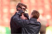 20 April 2021; Dundalk physiotherapist Danny Miller adjusts the protective facemask of Ole Erik Midtskogen of Dundalk before during the SSE Airtricity League Premier Division match between Derry City and Dundalk at the Ryan McBride Brandywell Stadium in Derry. Photo by Stephen McCarthy/Sportsfile