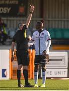 24 April 2021; Wilfred Zahibo of Dundalk receives a yellow card from referee Adriano Reale during the SSE Airtricity League Premier Division match between Dundalk and Drogheda United at Oriel Park in Dundalk, Louth. Photo by Ben McShane/Sportsfile