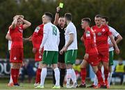 23 April 2021; Kevin Knight of Cabinteely, centre, is shown a yellow card by referee Alan Patchell during the SSE Airtricity League First Division match between Cabinteely and Shelbourne at Stradbrook Park in Blackrock, Dublin. Photo by Sam Barnes/Sportsfile