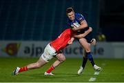 24 April 2021; Rory O'Loughlin of Leinster is tackled by Chris Farrell of Munster during the Guinness PRO14 Rainbow Cup match between Leinster and Munster at the RDS Arena in Dublin. Photo by Stephen McCarthy/Sportsfile