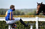 24 April 2021; Jockey Ryan Moore has a seat outside the parade ring prior to the Committed Stakes race at Navan Racecourse in Navan, Meath. Photo by David Fitzgerald/Sportsfile