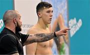 20 April 2021; Darragh Greene of National Centre Dublin with national senior team head coach Ben Higson on day one of the Irish National Swimming Team Trials at Sport Ireland National Aquatic Centre in the Sport Ireland Campus, Dublin. Photo by Brendan Moran/Sportsfile