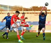 24 April 2021; Conor Murray of Munster kicks down field under pressure from James Ryan of Leinster during the Guinness PRO14 Rainbow Cup match between Leinster and Munster at RDS Arena in Dublin. Photo by Sam Barnes/Sportsfile