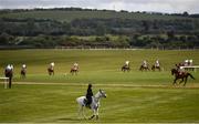 27 April 2021; RTE presenter Katie Walsh watches horses go to post prior to the Have The Conversation Say Yes To Organ Donation Novice Handicap Hurdle during day one of the Punchestown Festival at Punchestown Racecourse in Kildare. Photo by David Fitzgerald/Sportsfile